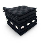 Stack of folded black and white checkered dishcloths on a white background