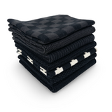 Stack of folded black and white checkered dishcloths on a white background