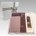 Gift box with 2 organic cotton facecloths, an 'Ashley & Co' Sooth Tube and a pack of Blooming Tea Balls. 